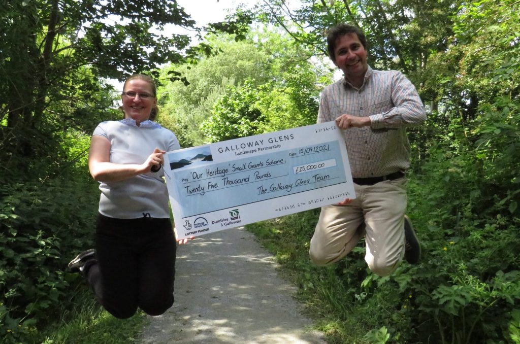 Anna Harvey and McNabb Laurie holding the big SGS cheque
