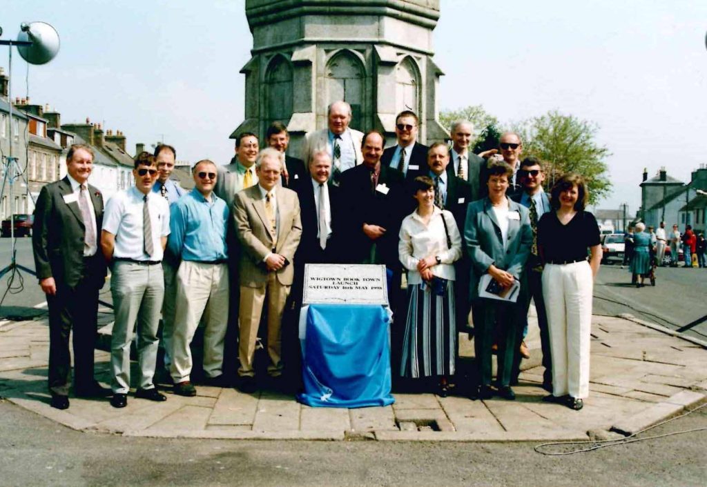 Pictured gathering in the town centre in 1998 to celebrate  the official launch of Wigtown as a book town.   