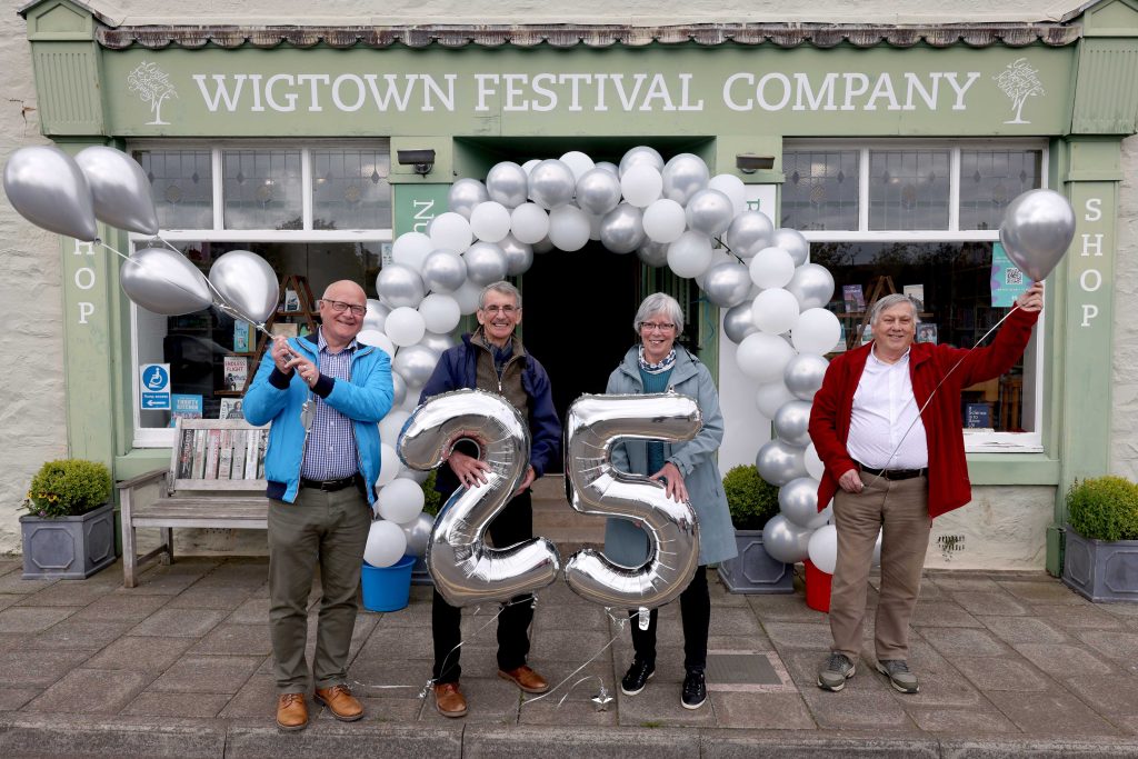 Pictured gathering in the town to celebrate today’s anniversary are Sandra McDowall (secretary of the Community Council which made the bid for Book Town status), with three former officers of Dumfries and Galloway Regional Council (now Dumfries and Galloway Council) - (from left) Derek Crichton (who was Area Manager, West), Les Jardine (who was Director of Community Resources and Graham Trickey (Head of Economic and Community Development).   