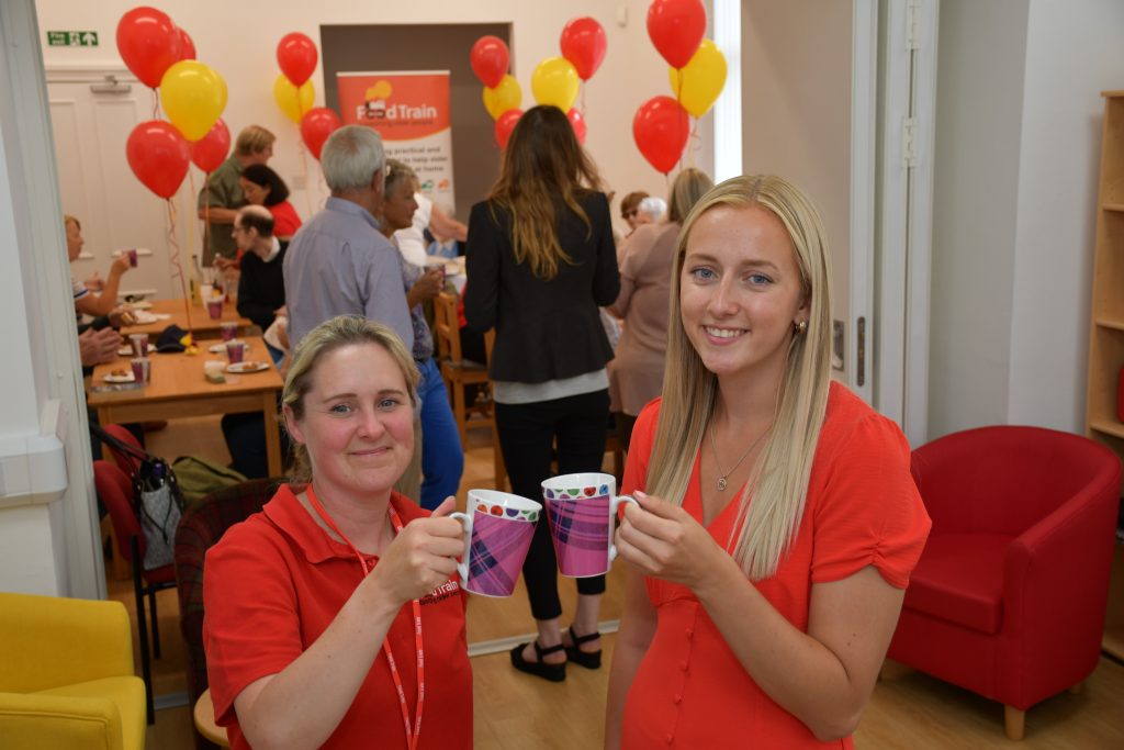 Food Train staff members Kirsty McCracken, left, and Melissa McCrindle toast the opening of the new community hub in Dumfries