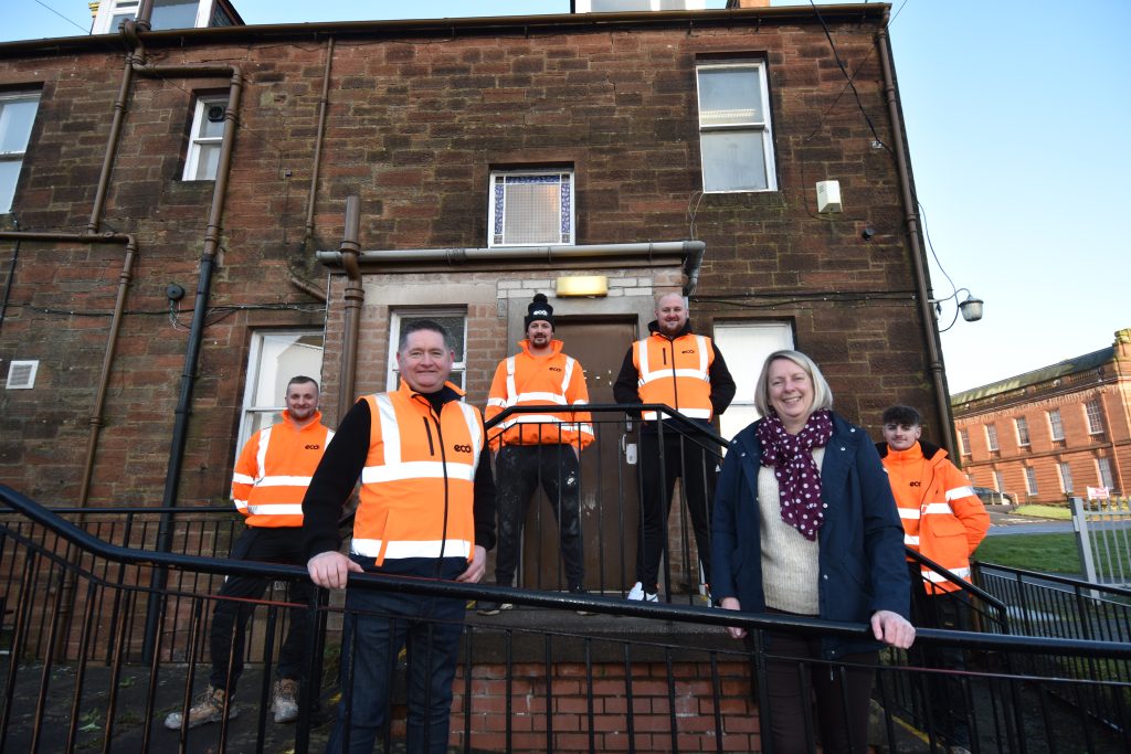 •	Eco Group managing director Eddie Black, front left, and Food Train chief executive Michelle Carruthers on-site at English Street, Dumfries, with Eco Projects team members, from left, Gavin Miller, Christopher McGarva, project manager Ryan Fieldston and Lewis Devlin.