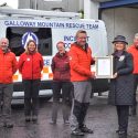 The Lord Lieutenant of Wigtown, Aileen Brewis presents the Queen's Award for Voluntary Service to Galloway Mountain Rescue.