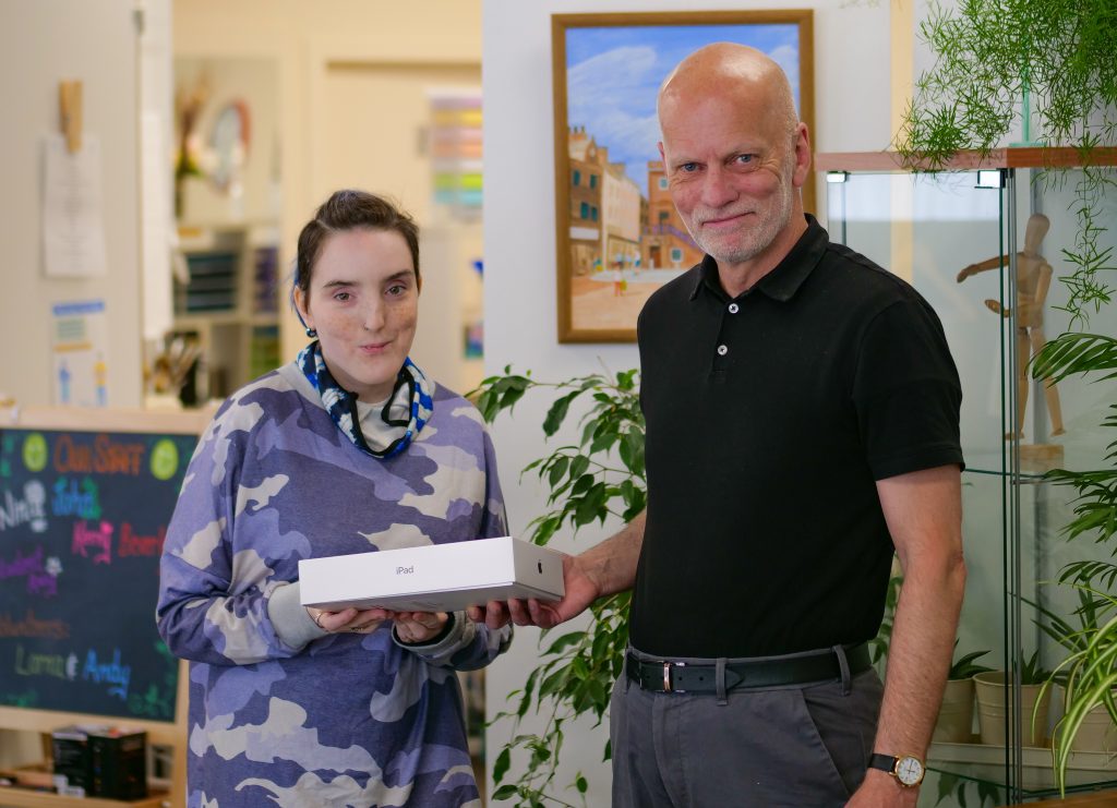 John Scott, Service Manager with Support in Mind Scotland in Dumfries, with service user Harley Milligan.