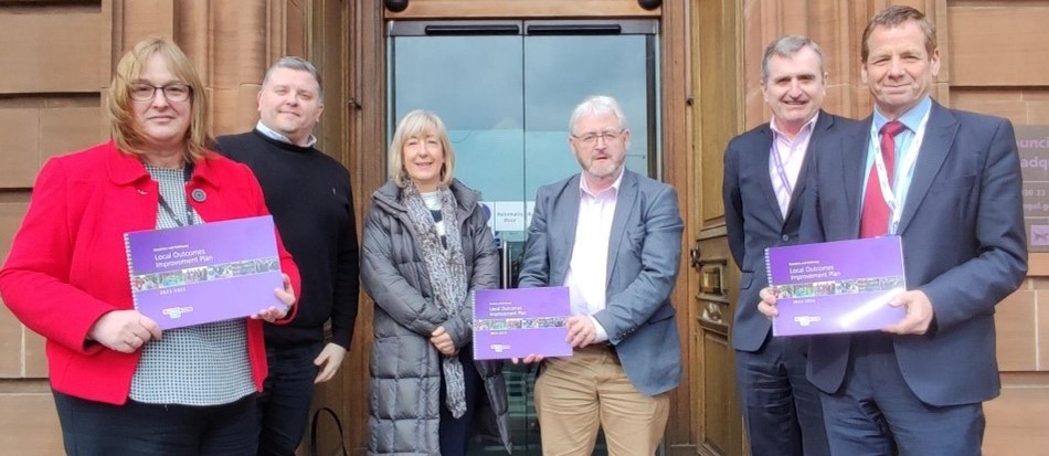 Alan Webb, Chief Executive Officer of Third Sector Dumfries and Galloway, second left, joins other community partners at the launch of the plan.