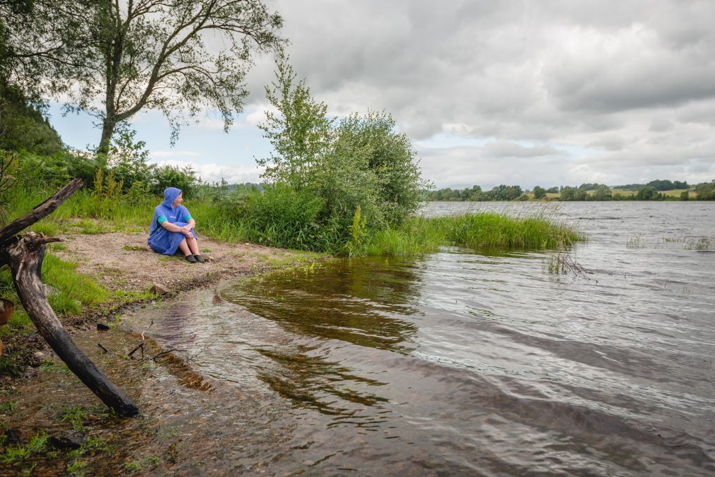 A wild swimmer steels herself before the plunge into Loch Ken.