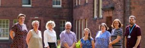 From left: Niomi Nichol, Health and Social Care Engagement Manager; Iona Callum, Programme Co-ordinator; Norma Austin Hart, Chief Executive Officer; John Dougan, TSDG Board Chair; Rachel Muir, Community Engagement Officer (Funding); Carol Bell, Hospital to Home Wraparound Coordinator; Claire Brown, Head of Operations; and Dan Allan, Information and Communications Officer.